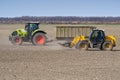 Spring work at farm. Farmer in tractor preparing the field for sowing. Farmer land and traktor