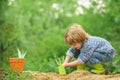 Spring work. Farming. Child on the garden. Home farm. Time to plant vegetables in the garden.