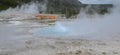Spring in Yellowstone National Park: Spouter Geyser of the Emerald Group in the Black Sand Basin Area of Upper Geyser Basin Erupts