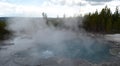 Spring in Yellowstone National Park: Steamy Bubbling Emerald Spring Drains Downhill in the Back Basin Area of Norris Geyser Basin Royalty Free Stock Photo