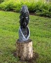 Springstone sculpture titled Spiritual Advisor by Augustine Mbirinyu in the Fort Worth Botanic Garden.