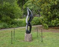 Springstone sculpture titled Undulating by Gift Mutsahuni in the Fort Worth Botanic Garden.