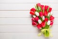 Springt time. Red tulip bouquet on the white wooden background. Royalty Free Stock Photo