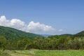 Springtime green forest, glade and valley among Lozen mountain, Plana mountain and snowy Vitosha mountain near to Pasarel village