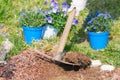 Springtime home gardening, hoeing soil and planting flowers