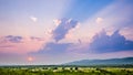 Springtime sunset landscape photography / Sun in the evening almost setting down over a large valley with fore