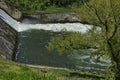 Springtime view of spillway in the dam of resort village Pancharevo Royalty Free Stock Photo