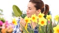 Springtime woman in garden with tools in hands