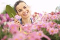 Springtime woman in garden with tools in hands