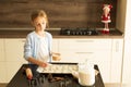 Sprinkle sugar on the Christmas coocies before baking Royalty Free Stock Photo