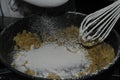Sprinkle white flour, cooking a bechamel sauce.
