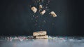 Sprinkled biscuits falling, studio shot, dark background, food photography Royalty Free Stock Photo