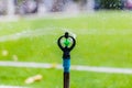 Sprinkler head watering the football field