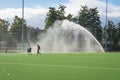 Sprinkler system is spraying a sports field