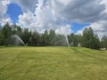 Sprinkler System Watering Golf Course Green Royalty Free Stock Photo