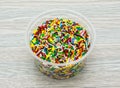 sprinkles bright colors served in disposable cup side view of indian and pakistani dessert