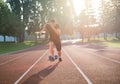 Sprinter leaving starting blocks on the running track. Explosive start. Royalty Free Stock Photo