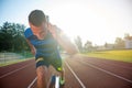 Sprinter leaving starting blocks on the running track. Explosive start. Royalty Free Stock Photo