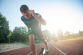 Sprinter leaving starting blocks on the running track. Explosive start. Royalty Free Stock Photo