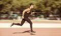 Sprinter leaving starting blocks on the running track. Explosive Royalty Free Stock Photo