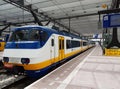 Sprinter train between Rotterdam and Gouda is waiting along platform at station Rotterdam Centraal in the Netherlands.