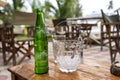 Sprite green glass bottle on the table in tropical cafe. Zanzibar, Tanzania