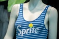 Sprite logo on blue stripped swimsuit on mannequin  in fashon store showroom Royalty Free Stock Photo