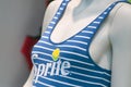 Sprite logo on blue stripped swimsuit on mannequin  in fashon store showroom Royalty Free Stock Photo