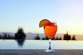 Spritz Veneziano, an Italian wine-based cocktail drink, served on a summer evening at the pool, copy space in the clear sky Royalty Free Stock Photo