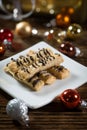 Cookies sticks on a small plate on wooden background