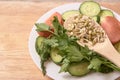 Sprouted beans.Tomato and cucumber. Wooden spoon. Fresh salad