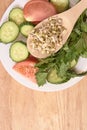 Sprouted beans.Tomato and cucumber. Wooden spoon. Fresh salad