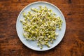 Sprouted green mung beans. Mung sprouts on plate Royalty Free Stock Photo