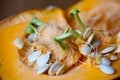 Sprouting pumpkin seeds and fibrous strands within cut pumpkin. Close-up
