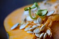 Sprouting pumpkin seeds and fibrous strands within cut pumpkin. Close-up