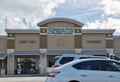 Sprouts Farmers Market business storefront exterior and parking lot in Houston, TX.