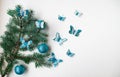 A spruce branch decorated with butterflies and balloons Royalty Free Stock Photo