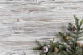 spruce branches, christmas tree, cones and decorations on rustic wood brown, white and gray burned planks. New Year. Flat lay, top Royalty Free Stock Photo