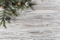 Spruce branches, christmas tree, cones and decorations on rustic wood brown, white and gray burned planks. New Year. Flat lay, top Royalty Free Stock Photo