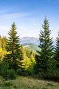 beautiful sunny scenery with distant valley and hills in morning light