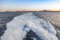 Spume of ferry ship with lanzarote skyline in background