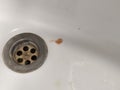 Sputum or saliva with blood in the sink