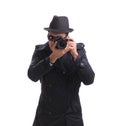 Spy with camera taking pictures isolated on white