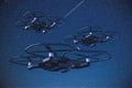 Spy drones flying at night with a 4k night vision camera on the night sky