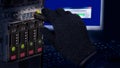 Hand in black glove holding USB flash drive. Computer data theft detail