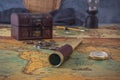 Spyglass and a compass lie on an old map against the background of a forged chest with coins.