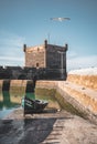 Sqala du Port, a defensive tower at the fishing port of Essaouira, Morocco near Marrakech. Blue sky with clouds and Royalty Free Stock Photo