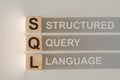 SQL abbreviation with text Structure Query Language by wood letters Royalty Free Stock Photo