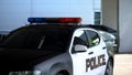 Squad car parked near police department, district patrol, maintenance of order