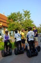 A squad of people riding segways